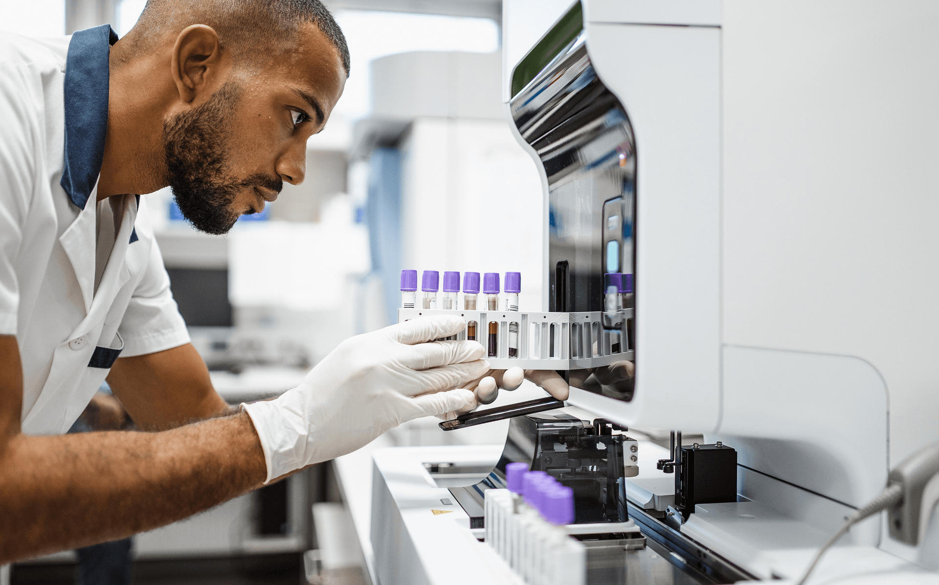 Lab worker loading samples